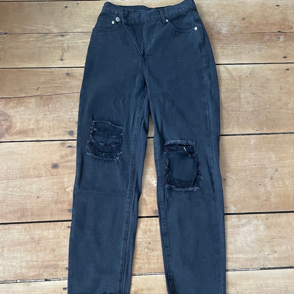 black asymmetrical jeans
